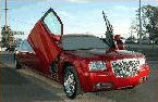 Chauffeur stretched red Chrysler C300 Baby Bentley limo hire with Lamborghini doors in Birmingham, Coventry, Dudley, Wolverhampton, Telford, Walsall, Stafford, Worcester.