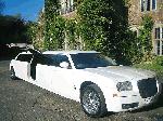 Chauffeur driven stretch limo white Chrysler C300 Baby Bentley with jet doors available in Brighton, Eastbourne, Hastings, Portsmouth, Crawley, Tunbridge Wells, Lewes, Worthing, Chichester, Bognor Regis, Horsham, East Grinstead, East Sussex and West Sussex.