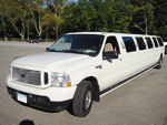 Chauffeur stretched white Ford Excursion 4x4 limo hire in UK