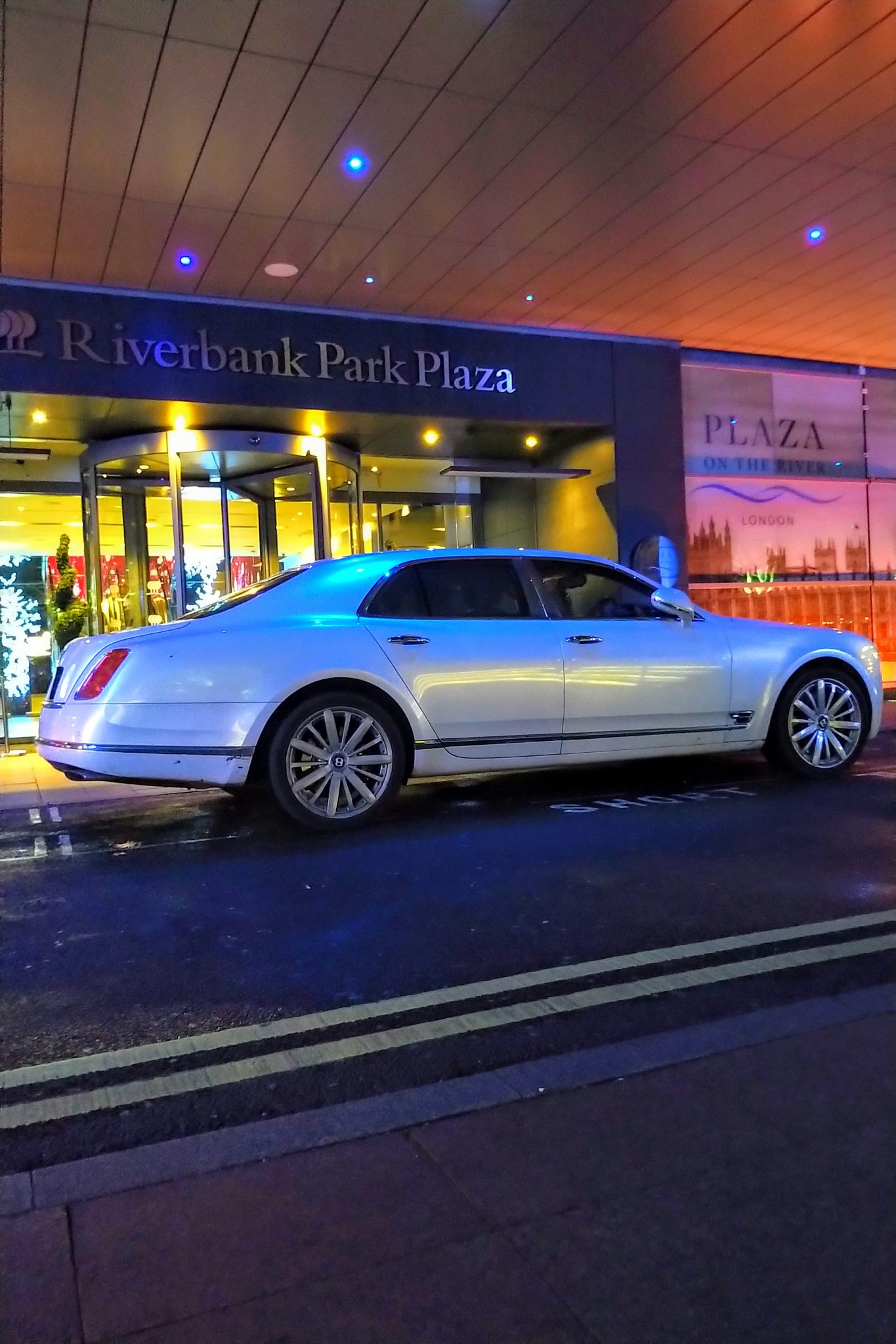 Luxury chauffeur car waiting for an evening at a show