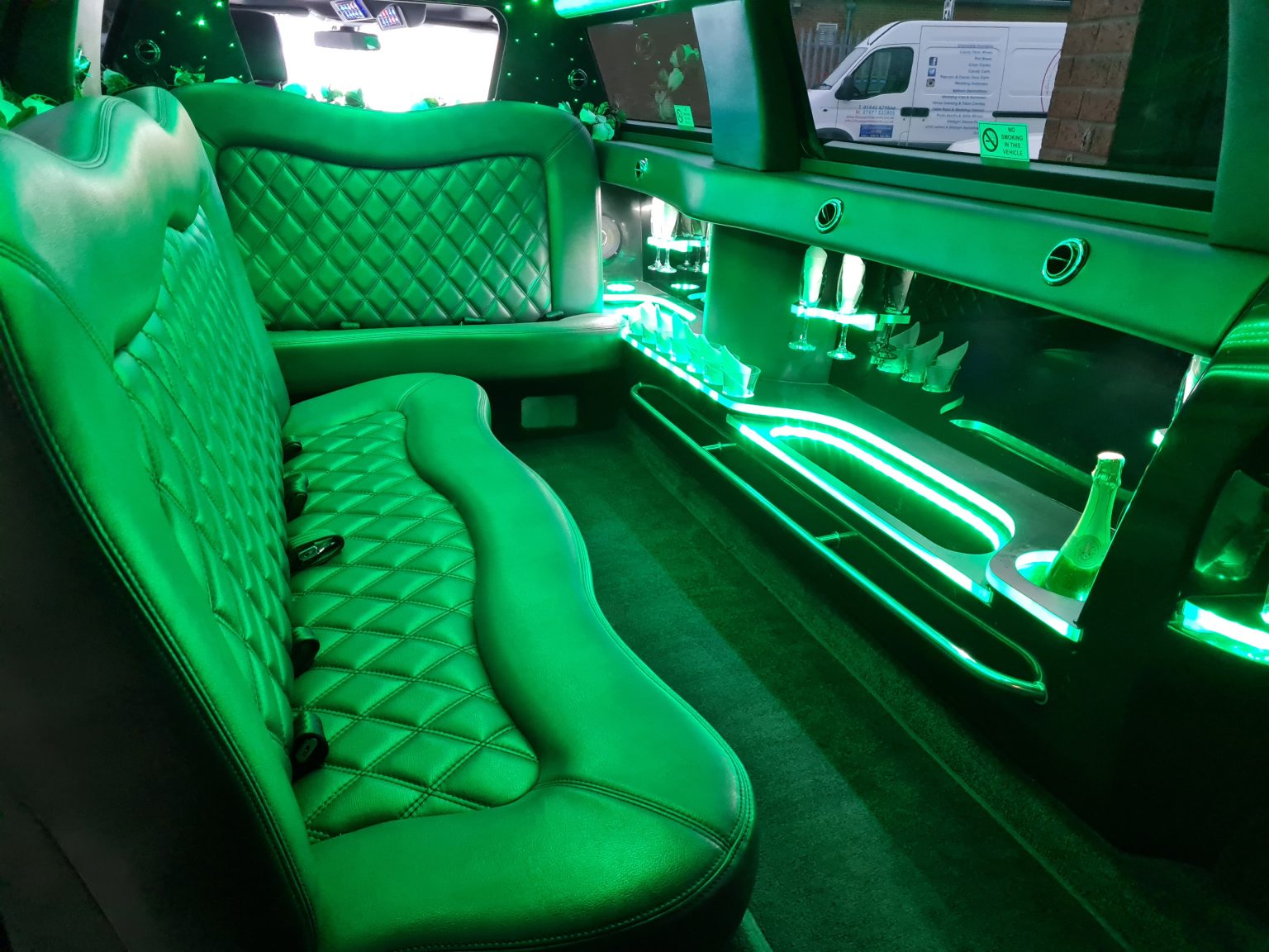 Stretch limousine interior with mood lighting for a Christmas party