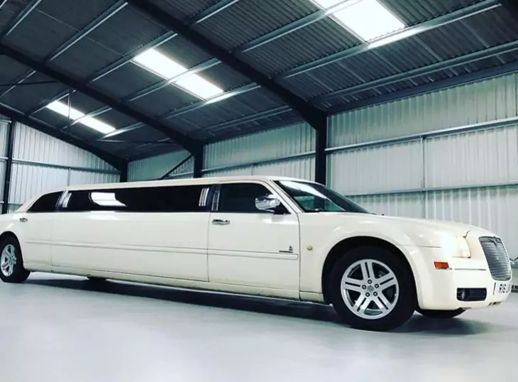 White Chrysler Baby Bentley stretch limo for a race day party